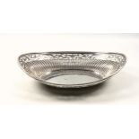 Victorian silver bread basket, of navette form, the reeded body with a floral pierced and bright-cut