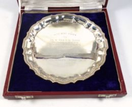 Indian white metal circular presentation salver with a beaded piecrust border, stamped "Silver",