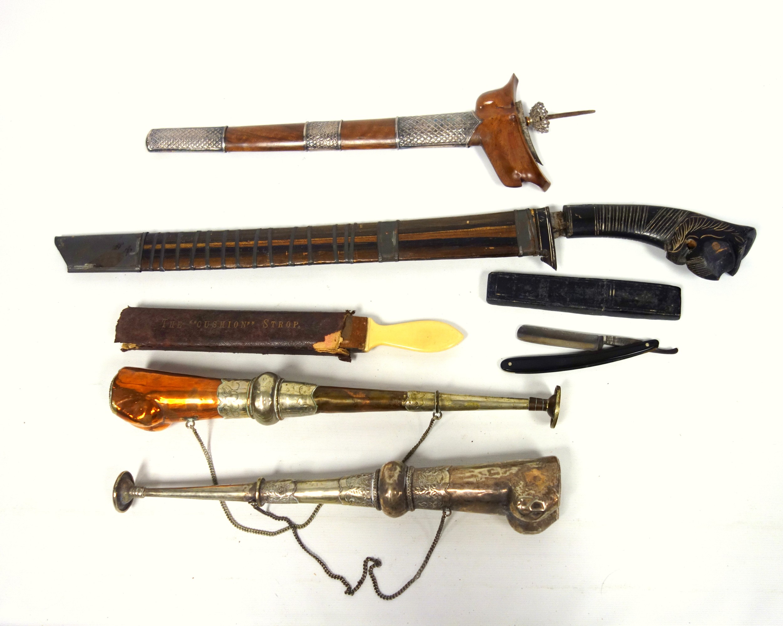 2 Eastern semi plated metal horns, 37.5 and 36cm long; 2 knives in scabbards, cut throat knife,