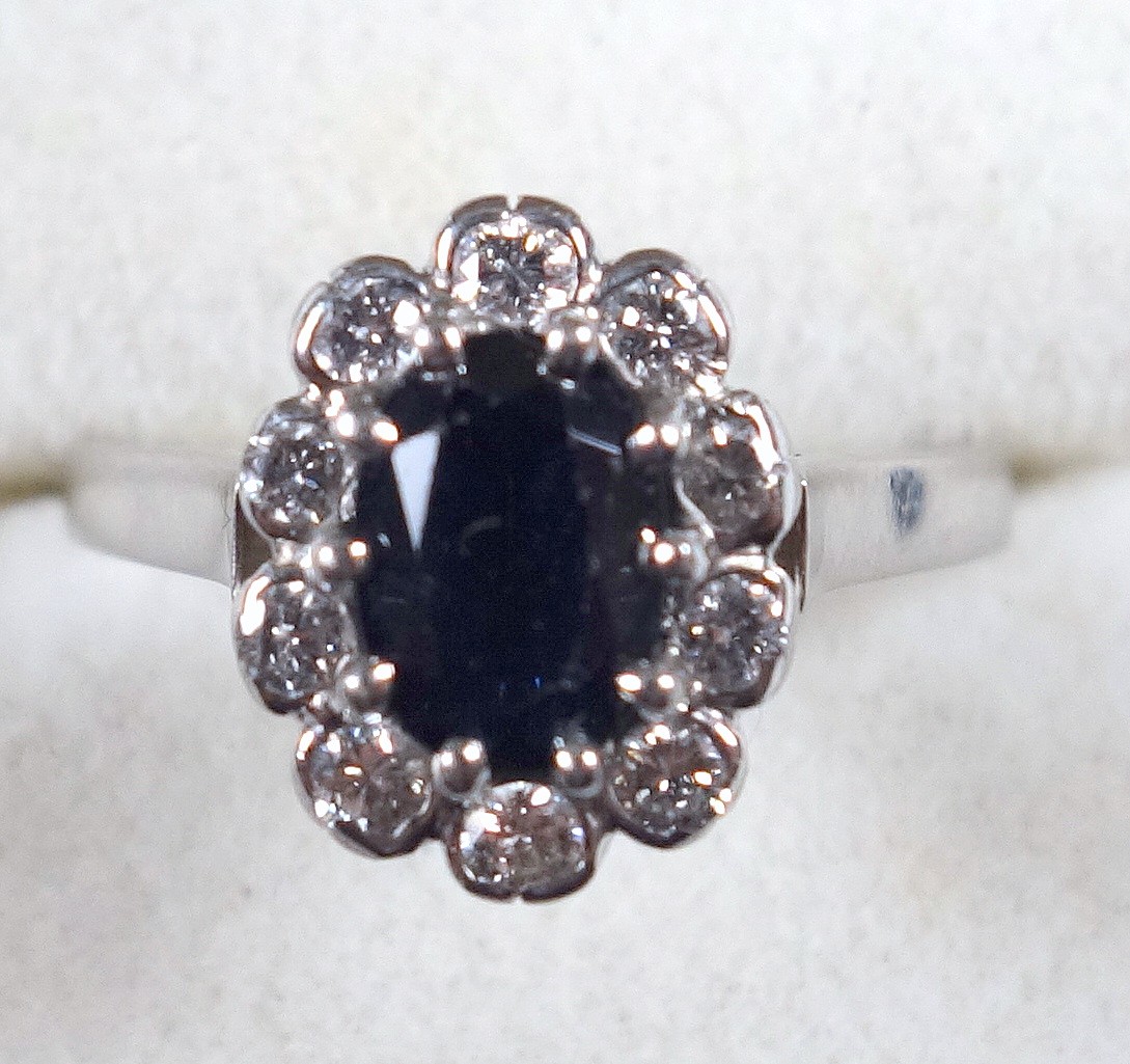 White metal ring set oval sapphire and 10 diamonds, stamped 750, 3.9grs - Image 2 of 2