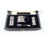 George V 4-piece silver cruet comprising mustard pot with small spoon, salt shaker and pepperette,