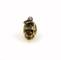 Late 18th century miniature gold skull pendant, with a hinged back, possibly a pill box, H. 12mm,