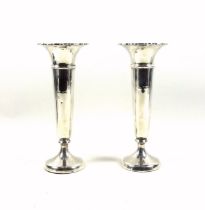 Matched pair of large George V silver posy vases, each with a pie crust rim, by H. W. & Co.,