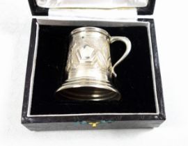 Indian silver miniature mug with embossed elephant and foliate decoration, stamped "Sterling