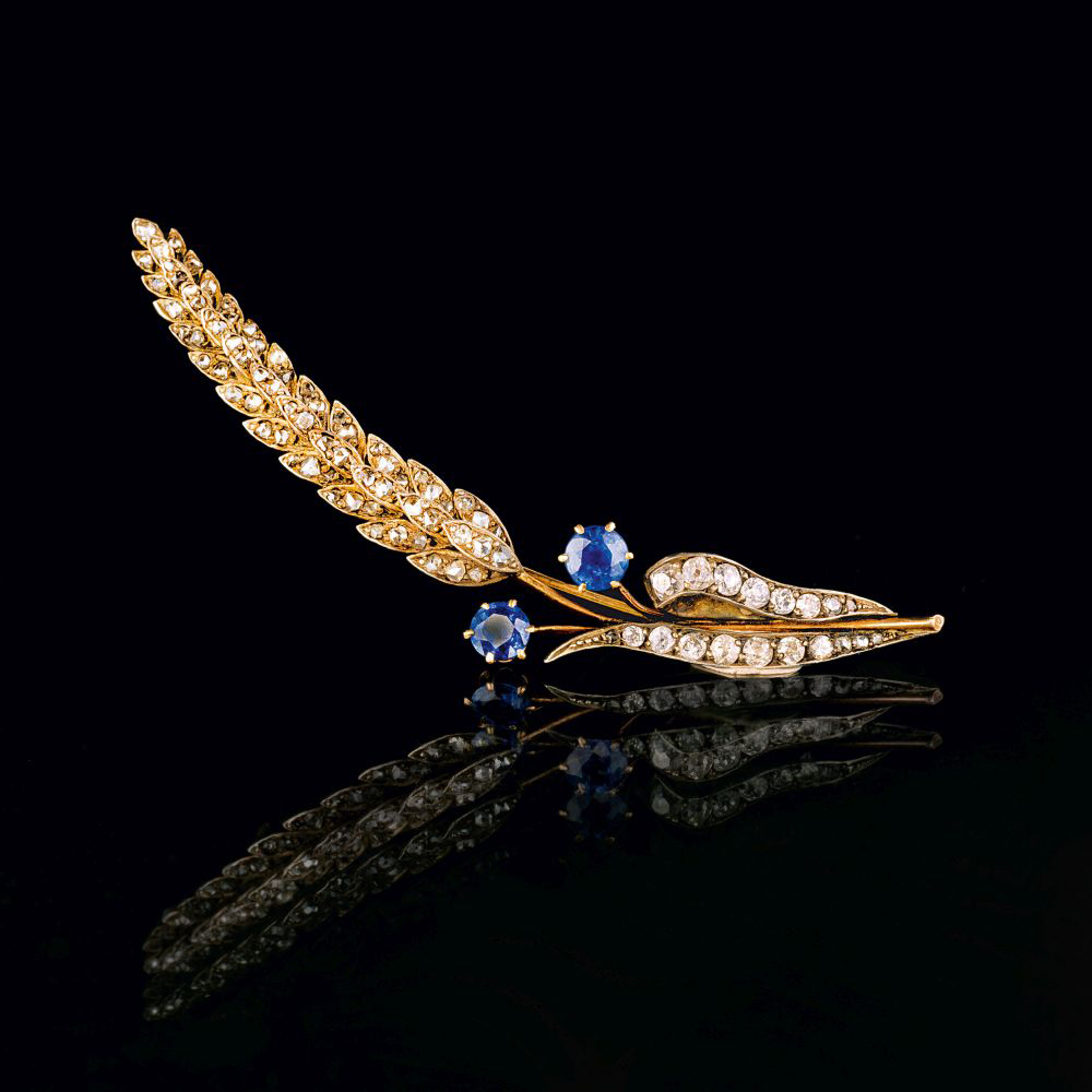 An Art Nouveau Diamond Sapphire Brooch 'Fleur de plumes'.