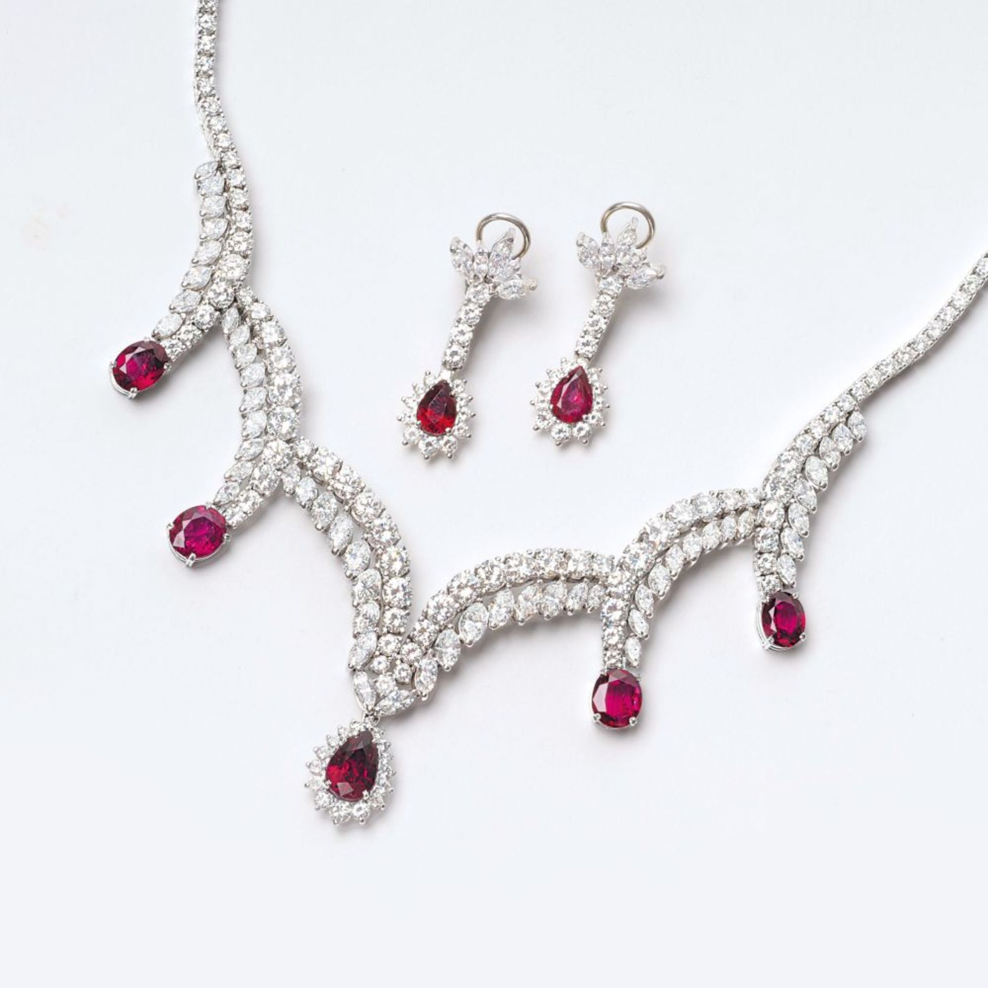 An unique 'Robe de gala' Demi Parure with naturals Rubies and fine white Diamonds.