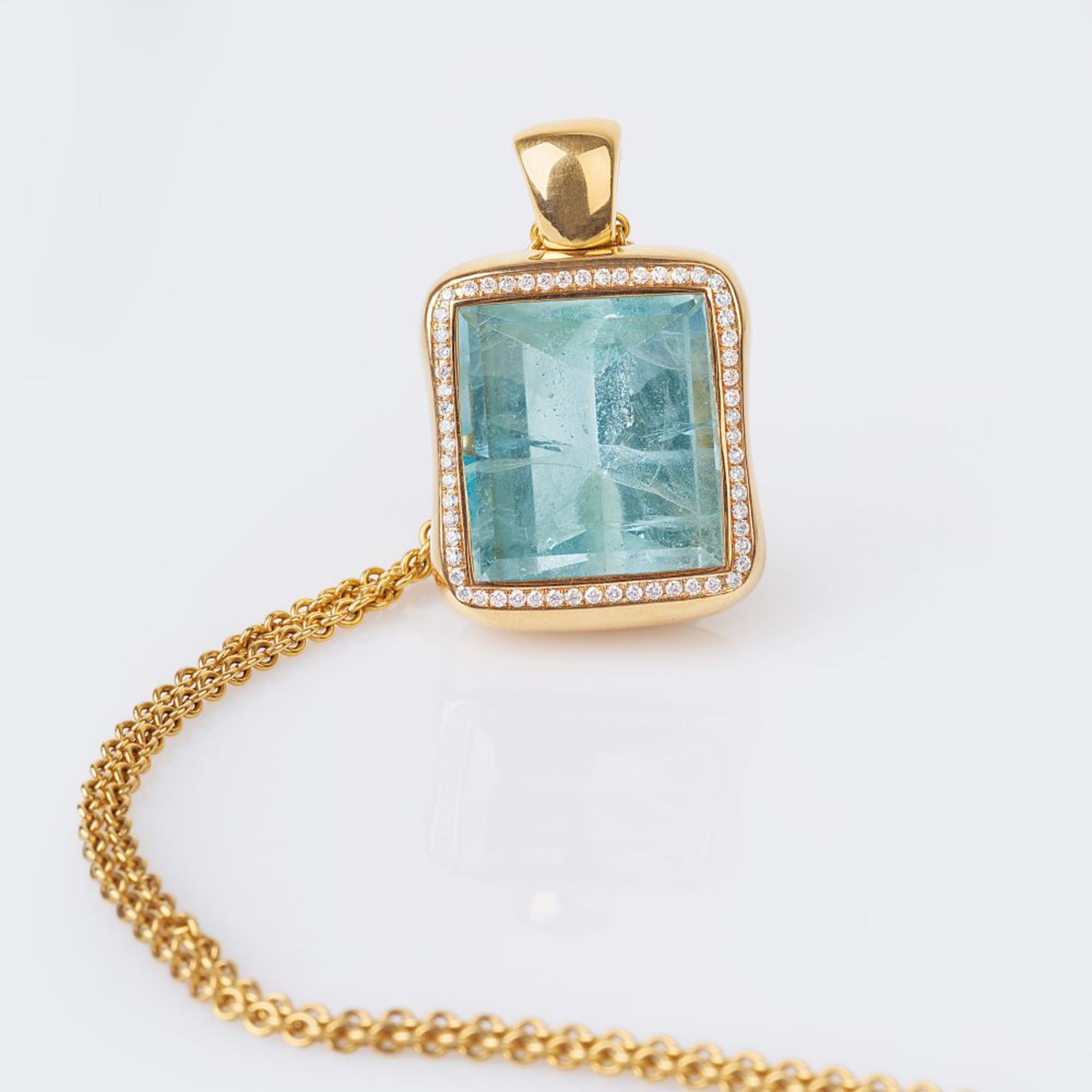 A large Aquamarine Diamond Pendant on Necklace.