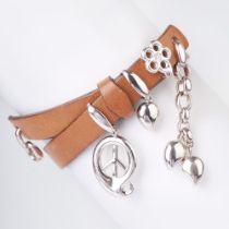 Tamara Comolli. A Wraparound Leather Bracelet with White gold Pendant 'Peace and Hearts'.