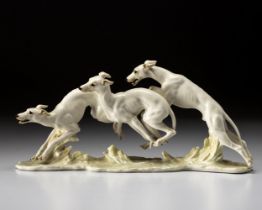 AÂ HUTSCHENREUTHER PORCELAIN 'THREE RUNNING GREYHOUNDS' FIGURINE BYÂ HANS ACHTZIGER