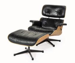 A LOUNGE CHAIR AND OTTOMAN, DESIGNED IN 1956 BY CHARLES AND RAY EAMES, MANUFACTURED BY VITRA