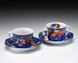 A PAIR OFÂ HERMÃˆS PORCELAIN 'MARQUETERIE DE PIERRES d'ORIENT ET D' OCCIDENT' PATTERN CUPS AND SAUCE