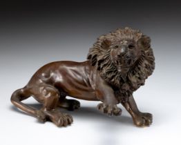 A BRONZE FIGURE OF A LION