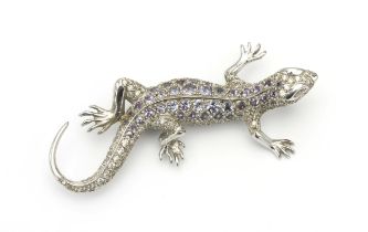 A GOLD, DIAMOND AND TANZANITE BROOCH