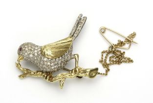 A GOLD AND DIAMOND BROOCH