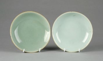 A NEAR PAIR OF CHINESE CELADON GLAZE DISHES, QING DYNASTY, EARLY 19TH CENTURY