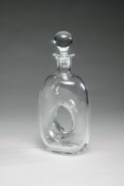 A HAND BLOWN DOUGHNUT HOLE GLASS DECANTER