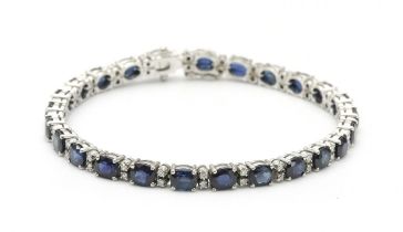 A SAPPHIRE AND DIAMOND TENNIS BRACELET