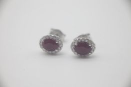 Fine 18ct White Gold Diamond and Ruby Stud EarringsWith an estimated 1.23 carats of Rubies and 0.