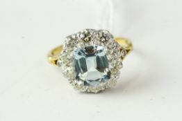 Fine 18ct gold platinum and diamond aquamarine cluster ring. The head of the ring measures 1.5cm