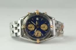 BREITLING CHRONOMAT REFERENCE B13050.1, circular blue dial with gold subsidiary dials, chronograph