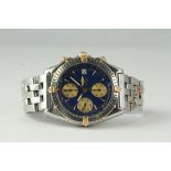 BREITLING CHRONOMAT REFERENCE B13050.1, circular blue dial with gold subsidiary dials, chronograph