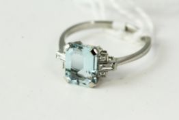 Fine platinum diamond and aquamarine ring, set in platinum with diamonds either side of an