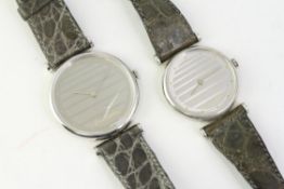 *TO BE SOLD WITHOUT RESERVE* A PAIR OF PIERRE CARDIN WATCHES (HIS & HERS), silver stiped dial, dot