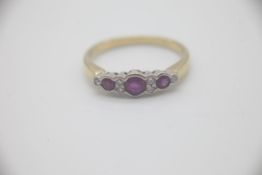Fine 18ct Gold Ruby and Diamond RingSet with alternating Rubies and Diamonds in an rub over setting.