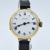 LONGINES TRENCH WATCH WITH ENAMELLED DIAL AND ROMAN NUMERALS AND CENTRE SECONDS IN 18CT GOLD CASE