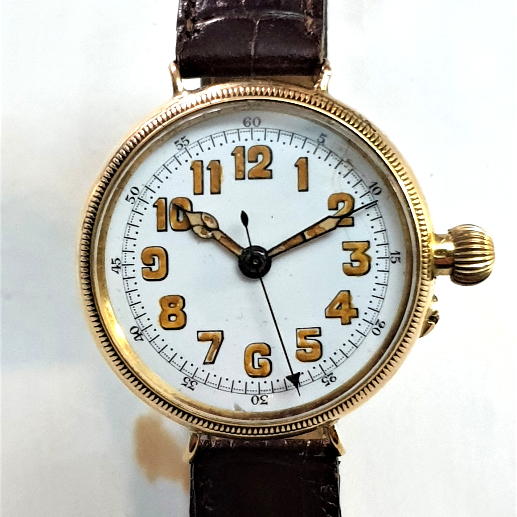 OFFICER'S TRENCH TYPE DOCTORS WATCH WITH ENAMELLED DIAL AND CENTER SECONDS IN SOLID 18CT GOLD BORGEL