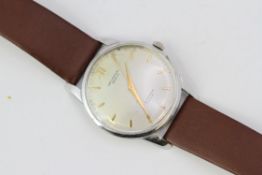 DOUBLE SIGNED UNIVERSAL GENEVE J.W BENSON 35MM, Circular silver dial with baton hour markers. In a
