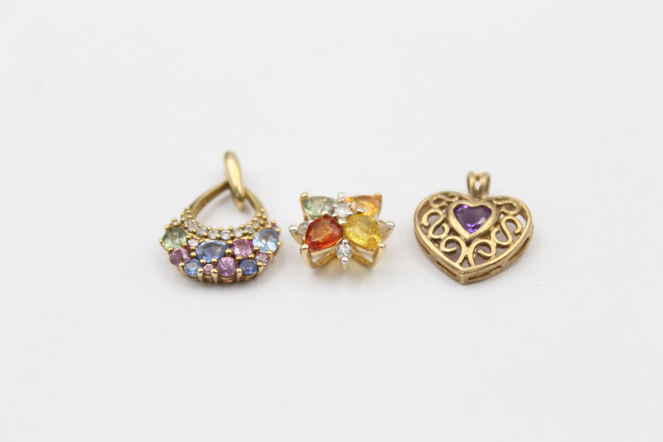 3 x 9ct gold openwork gemstone pendants inc. amethyst & vari-hue sapphire (4.5g)