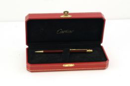 CARTIER BALLPOINT WITH BOX, red lacquer case, gold detail, with Cartier box, with presentation