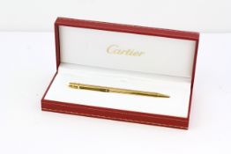CARTIER GOLD PLATED BALL POINT PEN, GOLD PLATED CASE, TWIST TOP, WITH BOX AND PAPERS