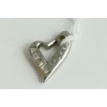 Fine 18ct gold and heavy diamond heart pendant . Set in heavy white gold with diamonds. Weighs 10.