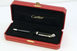 CARTIER ROADSTER BALLPOINT PEN WITH BOX, black tapering design with cabochon set top, with Cartier