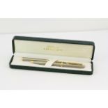 BOSTON PEN AND LETTER OPENER SET, brushed steel case and handle, gold plated detail and blade,