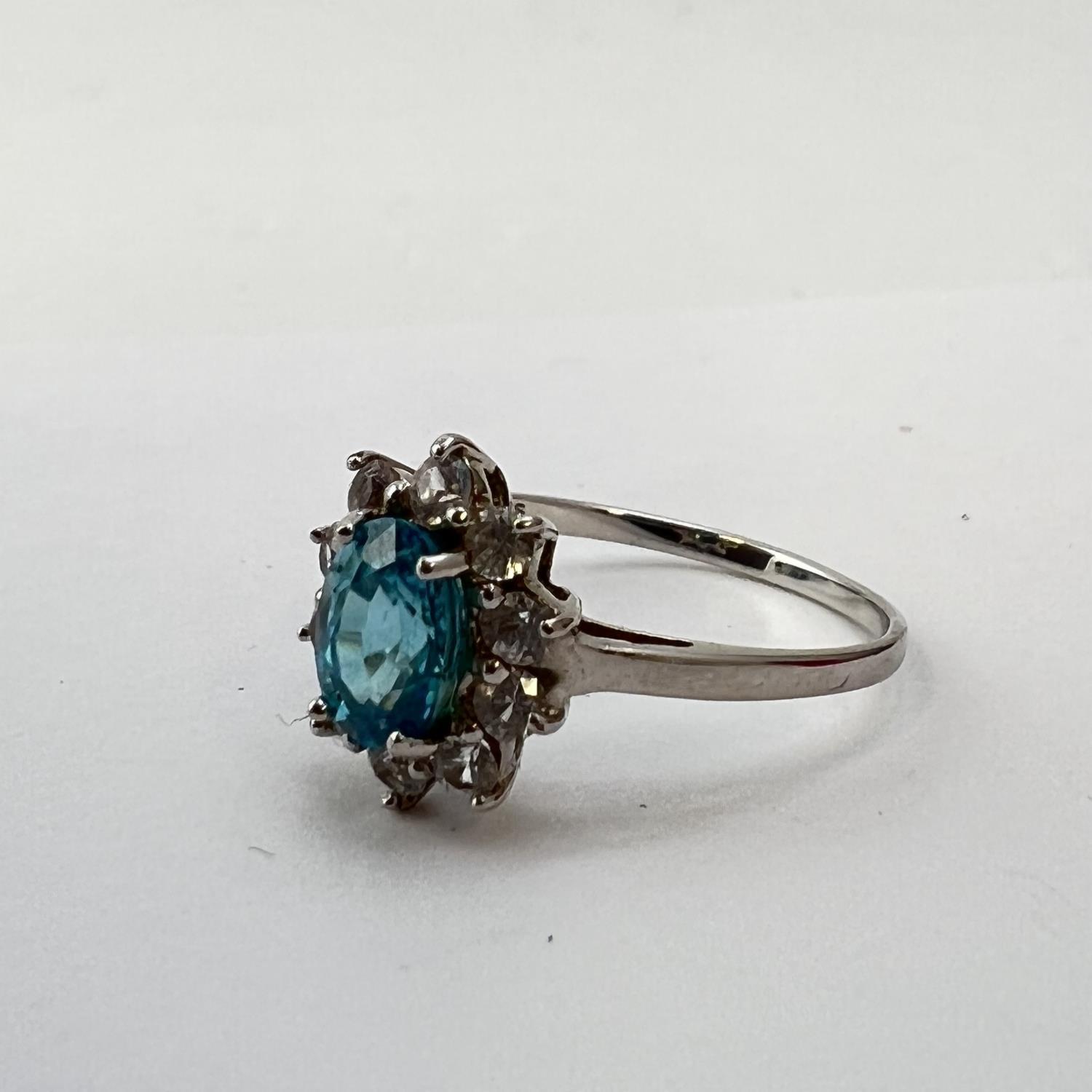Fine 9CT white gold blue zircon cluster ring. Marked 9K. Set with a oval shaped blue zircon - Image 2 of 3