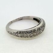 In white gold a slender pave set dome ring. Ring size R1/2