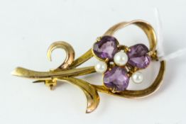 Fine 9ct gold amethyst brooch . Set with amethysts and pearls . Measureâ€™s 4.5cm in length . Weighs