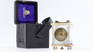 PERIOD MINIATURE CARRIAGE CLOCK, MOTHER OF PEARL WITH LEATHER CASE, 36x30mm case with chrome feet