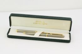 BOSTON PEN AND LETTER OPENER SET, brushed steel case and handle, gold plated detail and blade,