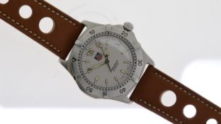 TAG HEUER PROFESSIONAL QUARTZ WATCH REF WK1112, circular silver dial w/ baton hour markers, date
