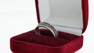 Vintage sterling silver Georg Jensen band ring, marked with Georg Jensen in a starburst inside the