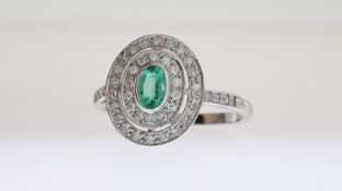 Platinum oval emerald inside a double halo of Edmonds E0.50 D0.40