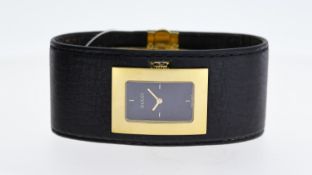 LADIES GUCCI REF 7800L, approx 23mm black dial, stick hour markers, gold plated bezel and crown,