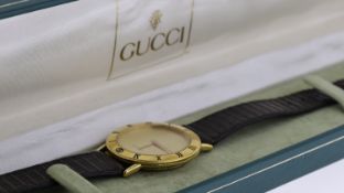 GUCCI WATCH REF 0328300 W/BOX, approx 32mm dial, gold plated bezel engraved with Roman Numeral