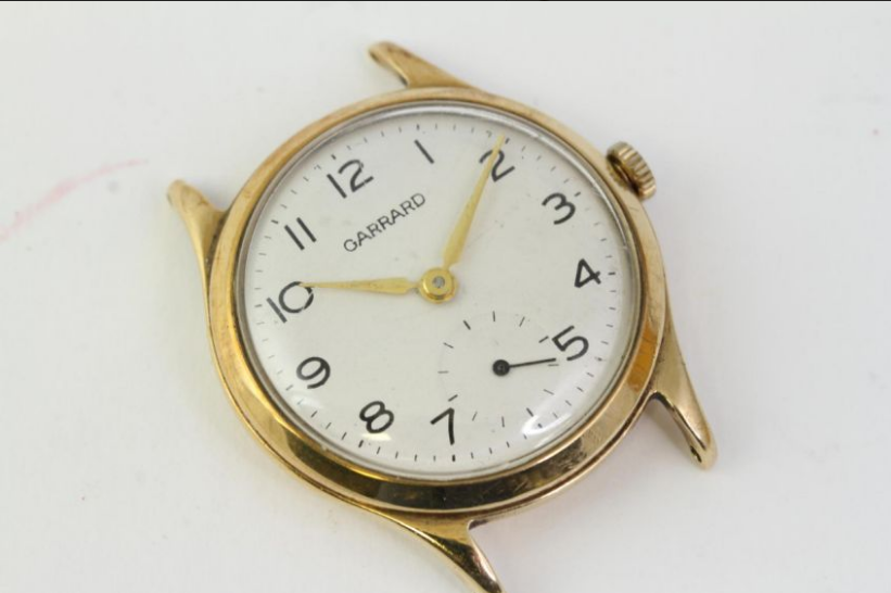 VINTAGE 9CT GARRARD MANUAL WIND WRISTWATCH, circular white dial with arabic numeral hour markers,