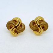 Yellow gold swirl earrings with posts and clip up backs. Weight 11G. The earrings are marked with