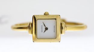 LADIES GUCCI REF 1900 L, approx 19mm white dial, gold plated bezel and case, Gucci crown, gold